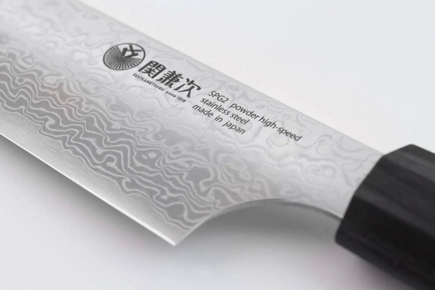 Couteau santoku japonais Kanetsugu Zuiun acier SPG2 damas 18cm